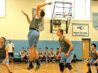 Medfield  boys volleyball splits home games
