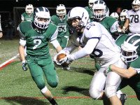 Defense propels football to second round