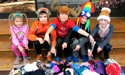 Medfield students give, wear hats