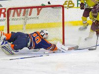 Corcoran guides Rebels in Super Eight opener