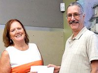 Evening Garden Club presents library donation