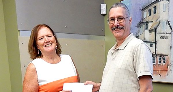 Evening Garden Club presents library donation