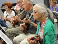 Ukulele players swap campfire for class
