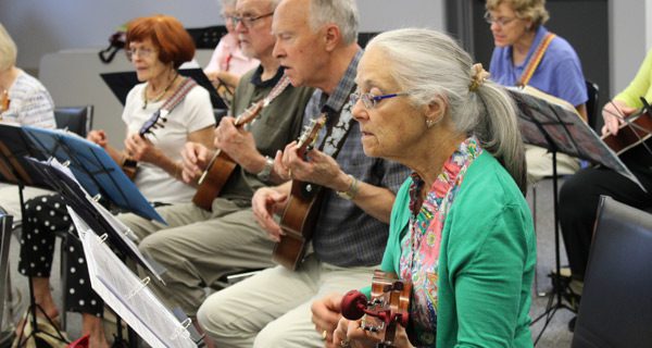 Ukulele players swap campfire for class