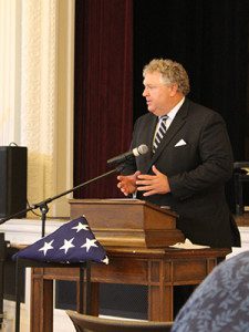  Town Moderator, Michael Fee, speaks about James Hugh Powers as they celebrate his life and his commitment to the town of Needham.