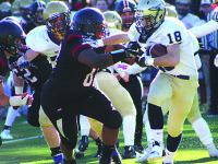 Ogletree’s three TDs not enough for Rockets