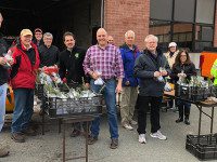 Rotarians distribute saplings to students