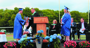 Headmaster John Smith congratulates recipients of the Lonergan Award. Photos by Laura Drinan