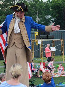 A young boy tries to give a high five to a very tall revolutionary soldier. Photos by Daniel Curtin 