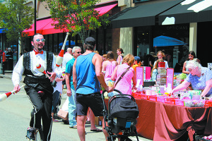 July Jubilation in a nutshell: an entertainer makes his way past shoppers poring through a 70-percent-off... 			
			</div>
				<a href=
