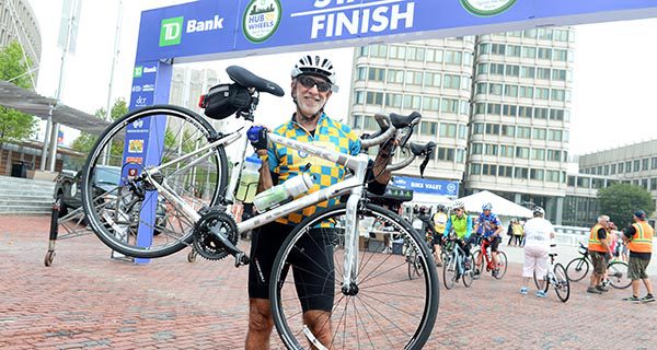 Needleman riding in Hub on Wheels