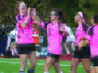 Girls soccer rolls on Pink Day