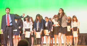 Zack Sickles as Glen Guglia sings ‘All About the Greed’ with the ensemble in ‘The Wedding Singer.’