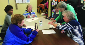 Creator of the “Mind over Matter Olympics,” Ora McGuire, hands out dot-to-dot puzzles to the different competitors.