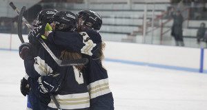 Britt Nawrocki, Maddy Foster, and Grace Kelley celebrate a first period goal. 