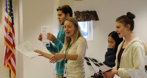 Smiles as Spanish carols are attempted.