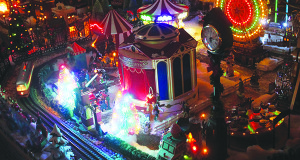 The lights of the Snow Village carnival can make you forget it is not a real place.