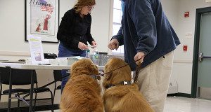 Two patients pay a visit to Powers to ensure that their licenses are up to date.   Photos by Alex Oliveira