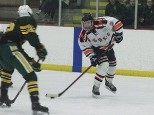 Junior forward Tom Fruci (3) fires a puck on net.  Photos by Michael Flanagan