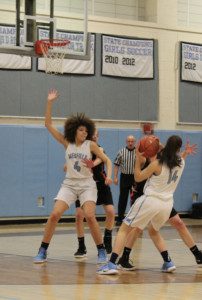 Junior Ceanna Kinney (4) posts up a defender. 