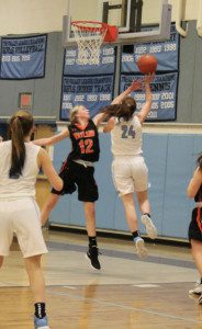 Senior captain Maeve Devlin (24) scores a big second half bucket. 