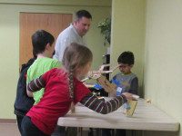 Young inventors make grabbers at library