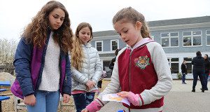 CRS student Erin Grimm sorts trash, recyclables and compost.