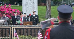 One of Wellesley’s firemen stoically watches the memorial. Photos by James Kinneen.