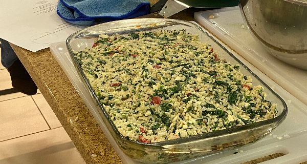 Seniors share casserole at cooking class