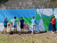 Needhamites paint community mural