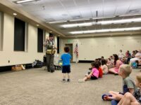 Walpole kids dig Dinoman