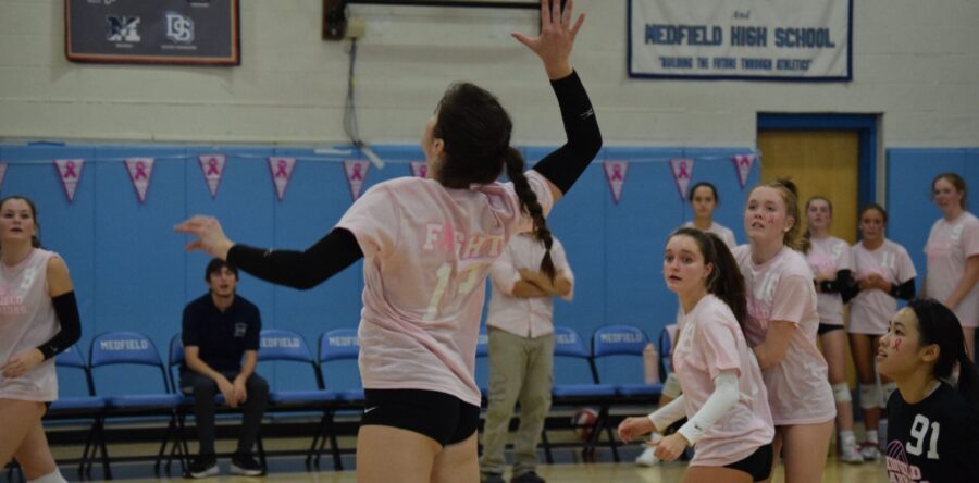 Warriors volleyball digs pink
