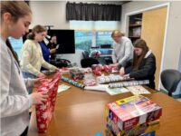 Intergenerational gift wrapping at the COA