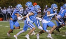 Medfield Football bests Bellingham on Senior Night