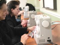 Residents Practice Sewing, Craft Neck Warmers at MPL