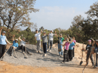 NHS students travel to help spread power of education